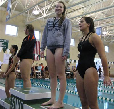 Junior Joan Dregalla receives her silver medal at SWC in the 200 Individual Medley.